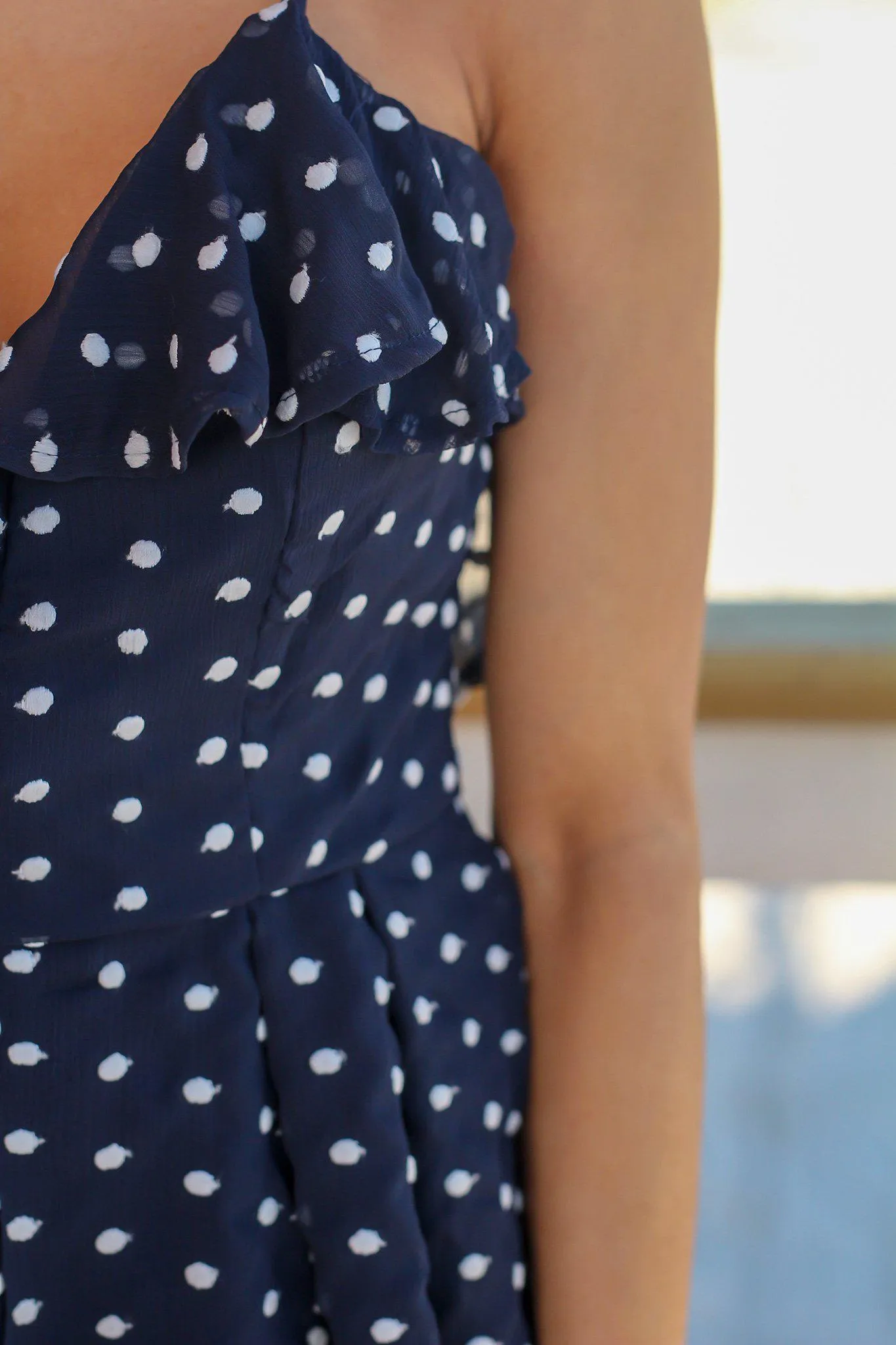 Navy Polka Dot Romper with Criss Cross Back